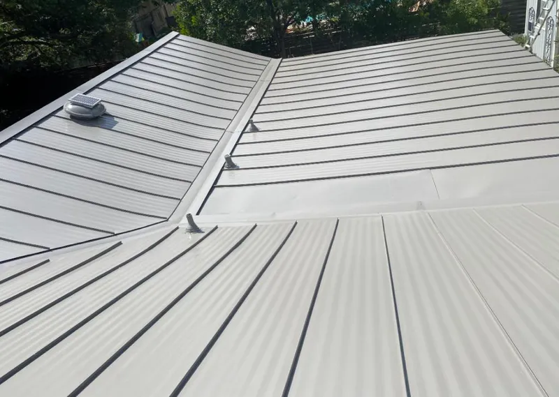 Solar attic fan installed on a metal roof for Roof Ventilation in Kennedale